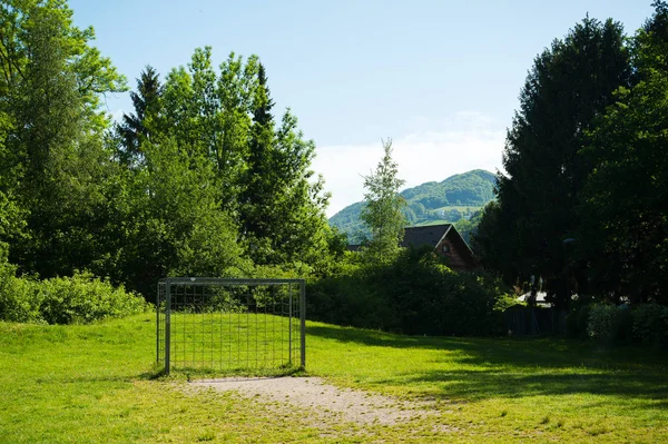 Football ground, soccer field with chain goals in the nature