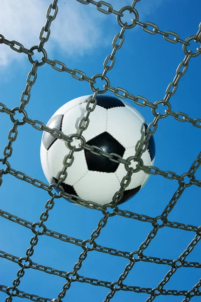 soccer ball in chain net white and black football, blue sky