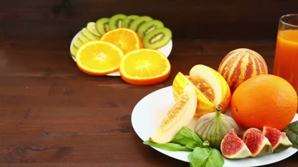 Table Lie Fruit Vietnamese Melon Figs Kiwi Oranges Juice Full — Stock Video