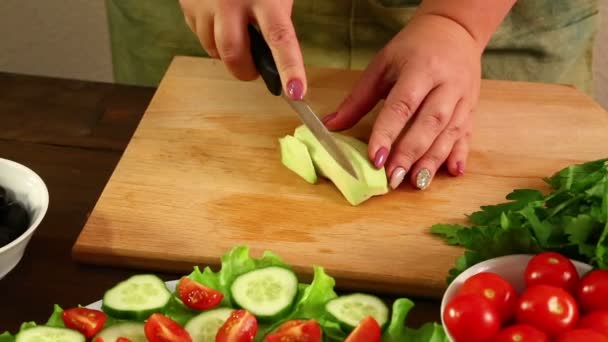 Woman Cuts Avocado Peeled His Peel Small Pieces Knife Close — Stock Video