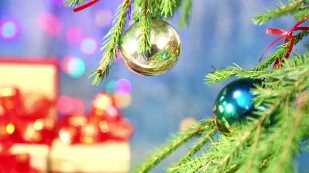 Christmas Tree Decorated Balls Blurred Focus Turns Gifts Red Bows — Stock Video