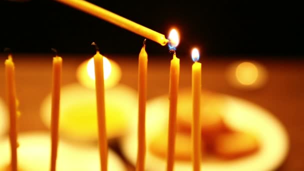 Woman Holds Burning Candle Her Hand Which She Lights Candles — Stock Video