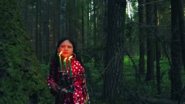 Young Gypsy Shuvani Holds Candlestick Burning Candles Looks Hide Tree — Stock Video