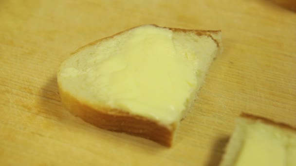 A woman lays salmon trout slices on a canape with butter — Stock Video