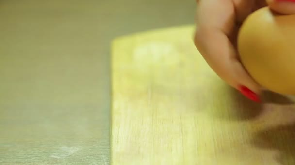 Woman cleans boiled egg on wooden board. Close-up — Stock Footage Woman cleans boiled egg on wooden board. Close-up Stock Video