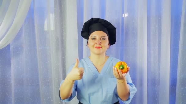 Female Cook Smiles Holds Yellow Pepper Her Hand Shows Class — Stock Video
