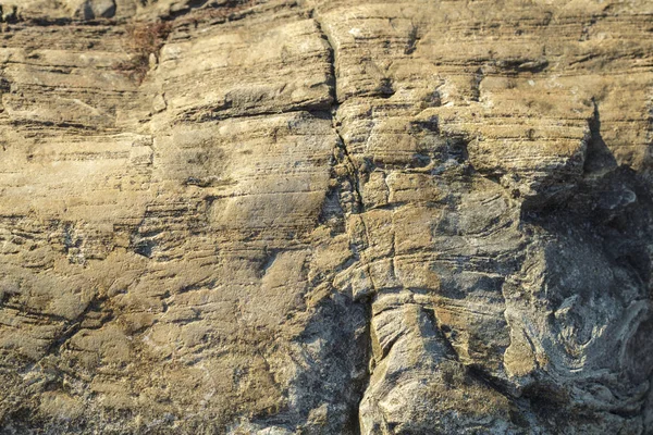 La superficie acanalada de la roca de cerca. Textura . — Foto de Stock