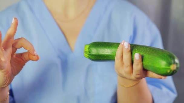 In female hands green cucumbers. Hand shows OK — Stock Video