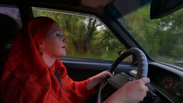 Young stylish Muslim woman in hijab driving a car — Stock Video