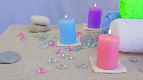 Spa salon with candles, towels and stones for therapy — Stock Video