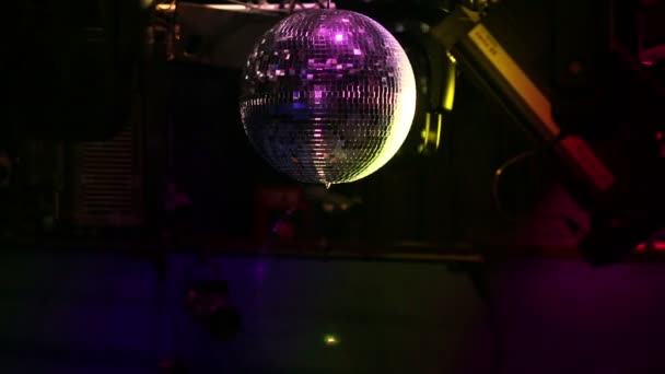 Mirror ball on a rail with lighting equipment — Stock Video