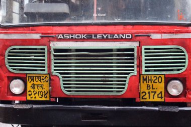 Translation: The red local public bus in Aurangabad, on the way to Ajanta or Ellora Caves. clipart