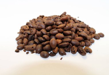 Indonesian roasted coffee beans, your source for a cup of coffee clipart