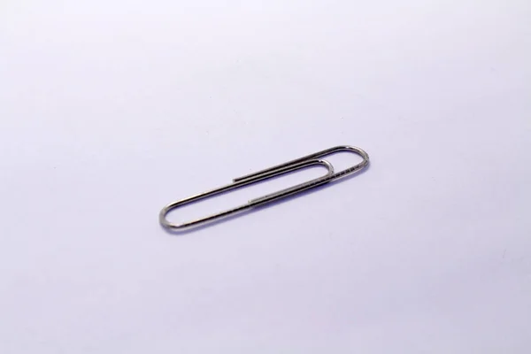 A pile of paper clip or paperclip, used to hold sheets together — Stock Photo, Image