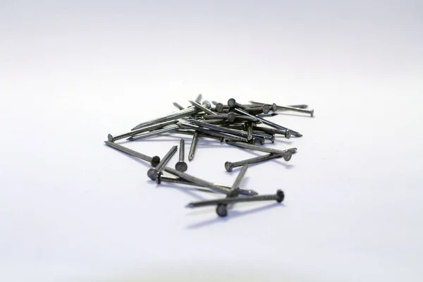 Hromadu hřebíky, špendlík ve tvaru objektu železa používaný jako uzávěr — Stock fotografie