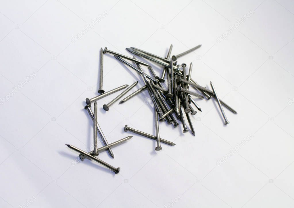 A pile of nails, a pin shaped object of metal used as fastener