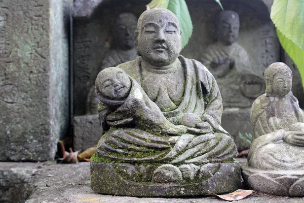 Statue of Buddha and Jizo at a Japanese temple.