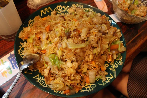 Japanese fried rice and noodle or soba meshi served at traditional izakaya in Beppu, Japan