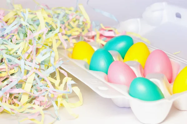 Colored multi-colored eggs and colored strips of paper, Easter decor