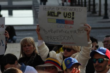 Venezuelans in Portugal Protest Against Venezuelan President Nicols Maduro in Porto, Portugal on 02/22/2014 clipart