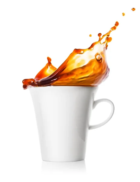 Spray and splash of coffee in cup — Stock Photo, Image