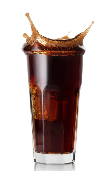 Splash in a faceted glass of cola — Stock Photo, Image