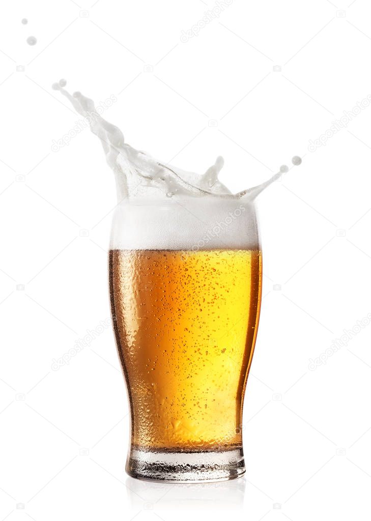 Splash of foam in glass of beer