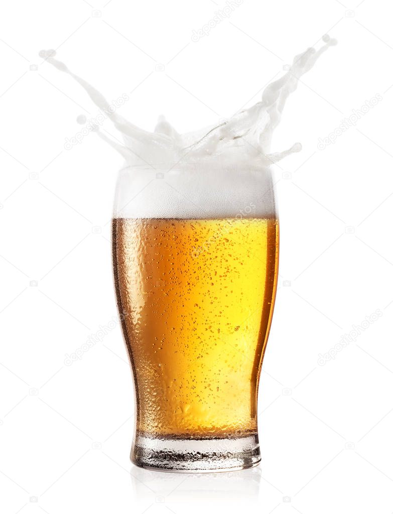 Splash of foam in a glass of beer