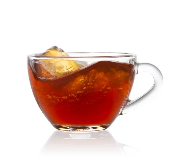 Splash in transparent cup of tea — Stock Photo, Image