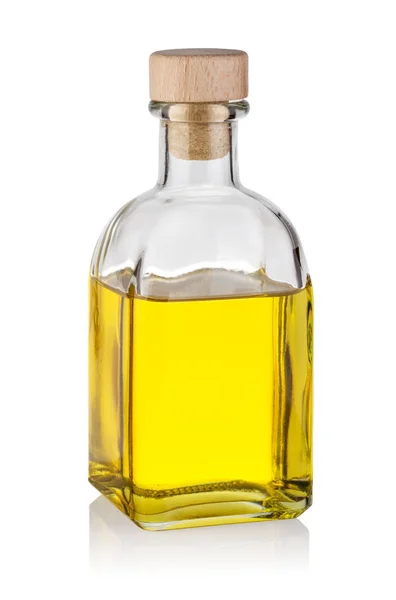 Bottle of yellow oil with wooden cork — Stock Photo, Image