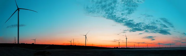 Panorama of wind farm at sunrise — Stock Photo, Image