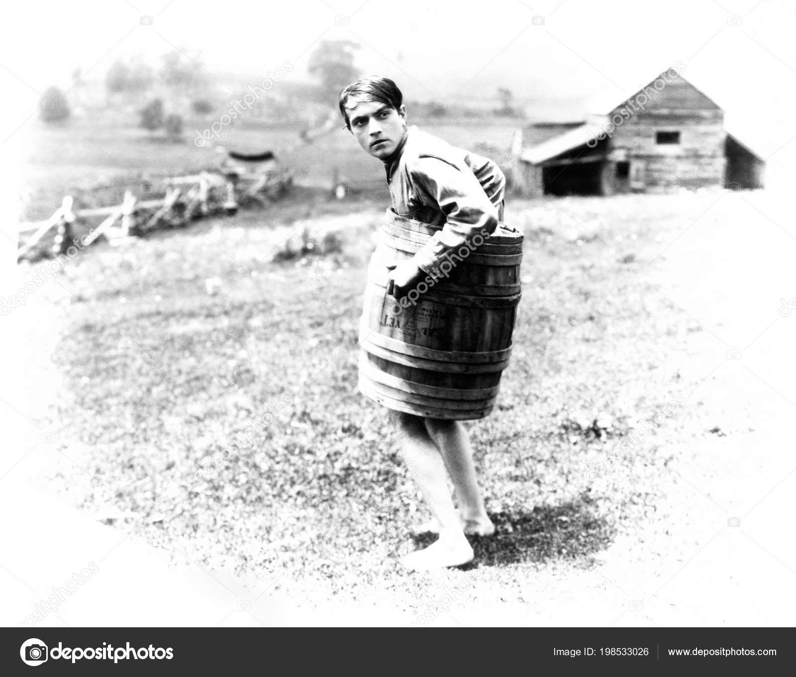 Barefoot Man Wearing Barrel Stock Photo by ©everett225 198533026