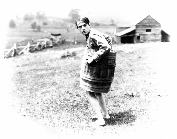 Barefoot Man Wearing Barrel — Stock Photo, Image