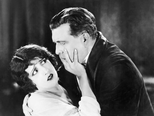 woman rejects a man's kiss