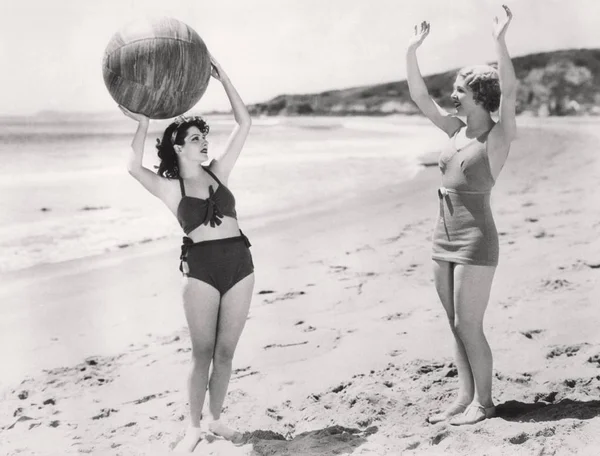 Two Women Playing Ball Beach Stock Photo