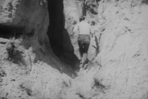 Cowboy Putting Box Dynamite Entrance Cave 1930S — Stock Video