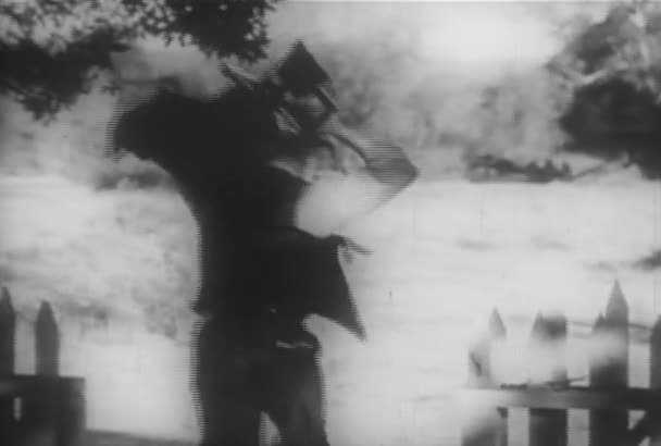 Rear View Man Carrying Tripod Camera Leaving Farm 1930S — Stock Video