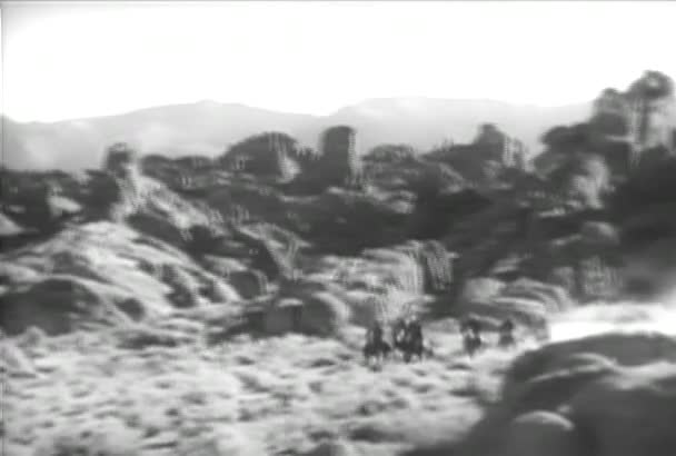 Group Cowboys Horseback Galloping Canyon 1930S — Stock Video