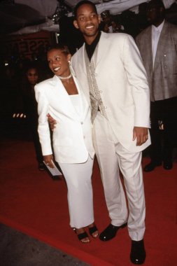 Will Smith & Jada Pinkett Smith in Gucci outfits at the Essence Awards at Madison Square Garden, NY 4/10/98, by Sean Roberts