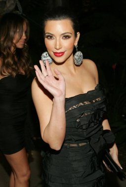 Kim Kardashian (wearing a Nina Ricci gown) at departures for 68th Annual Golden Globe Awards, Beverly Hilton Hotel, Beverly Hills, CA January 16, 2011. Photo By: James Atoa/Everett Collection clipart