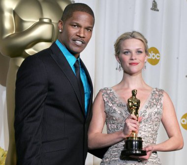Jamie Foxx, Reese Witherspoon in the press room for OSCARS 78th Annual Academy Awards, The Kodak Theater, Los Angeles, CA, Sunday, March 05, 2006. Photo by: Emilio Flores/Everett Collection clipart