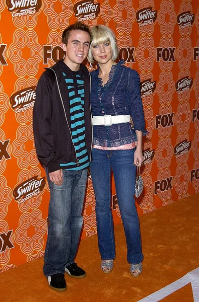 Frankie Muniz, and fiancee at arrivals for Sweep Up For Charity at the FOX Fall Casino Party, Cabana Club, Los Angeles, CA,October 24, 2005. Photo by: David Longendyke/Everett Collection