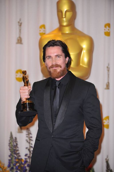 Christian Bale, Best Performance by an Actor in a Supporting Role for THE FIGHTER, Reese Witherspoon in the press room for The 83rd Academy Awards Oscars - Press Room, The Kodak Theatre, Los Angeles, CA February 27, 2011. Photo By: Gregorio T. Binuya