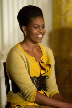 Michelle Obama (wearing a J. Crew cardigan and blouse) at a public appearance for White House Event on the Difficulties Older Women Face in the Health Insurance Market, the White House, Washington, DC November 13, 2009. Photo By: Stephen Boitano/Ever