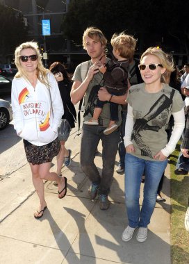 Kirsten Dunst, Ryan Hansen, Kristen Bell at arrivals for Invisible Children's Global Event: The Rescue, Santa Monica Pier to City Hall, Los Angeles, CA April 25, 2009. Photo By: Dee Cercone/Everett Collection
