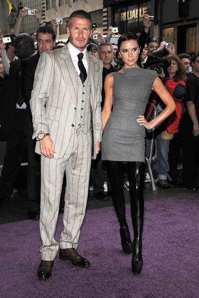 David Beckham (wearing a Tom Ford suit), Victoria Beckham (wearing Antonio Berardi) at in-store appearance for Beckham Signature Fragrance Exclusive Launch, Macy 's Herald Square, New York, NY, September 26, 2008. Фото: Lee / Everett Collection
