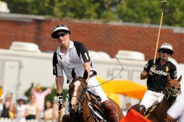 H.R.H. Prince Harry (L) and polo player Nacho Figueras, compete in a polo match on Governors Island out and about for CELEBRITY CANDIDS - SUNDAY, , New York, NY June 27, 2010. Photo By: Ray Tamarra/Everett Collection clipart