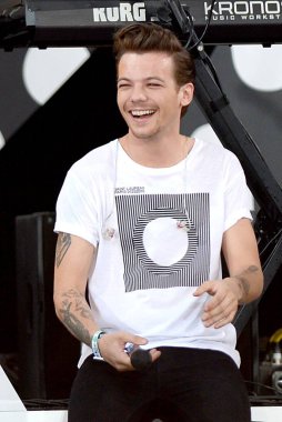 Louis Tomlinson (wearing a Saint Laurent t-shirt), One Direction on stage for ABC's Good Morning America (GMA) Fun in the Sun Summer Concert Series with One Direction (1D), Rumsey Playfield in Central Park, New York, NY August 4, 2015. Photo By: Kris