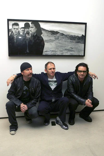 The Edge, Anton Corbijn, Bono at arrivals for Anton Corbijn photo exhibition celebrating 22 years of U2, Stellan Holm Gallery, New York, NY, October 09, 2005. Photo by: Gregorio Binuya/Everett Collection