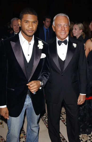 Usher and Giorgio Armani at The Conceptualist Fashion Group INTERNATIONAL 21ST ANNUAL NIGHT OF STARS at The Conceptualist Fashion Group INTERNATIONAL 21ST ANNUAL NIGHT OF STARS at Cipriani's, NY, October 28, 2004. (Photo by David Blackman/Everett Col